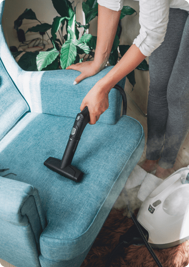 hand-cleaning-a-armchair-with-steam-cleaner-home-2024-10-15-04-00-49-utc